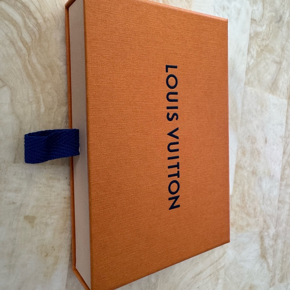 One men’s Louis Vuitton pocket organizer